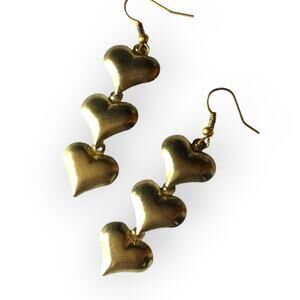 Dangling triple heart gold tone earrings